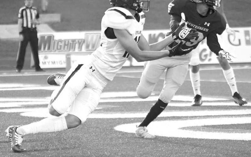 DIVING ATTEMPT- The Levelland Lobos fell to 0-3 after a road loss last Thursday against the Lubbock High Westerners, 21-14. Levelland receiver Mark Buxkemper attempted to make a diving catch in the endzone. The Lobos will welcome the Estacado Matadors in to town for homecoming next Friday. (Photo Courtesy of Dom Puente)