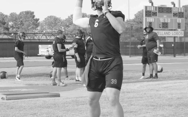 PRECISION - Levelland QB Rusty Johnson was in the motion of throwing the ball during practice drills at Levelland two-a-days training. (Staff photo by Aalijah Soliz)