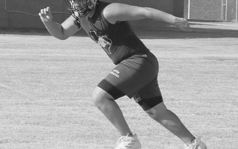 SPRINTS - Anton athlete Josh Garcia ran full speed to lay the lead block for his running back during team drills.(Staff photo by Aalijah Soliz)