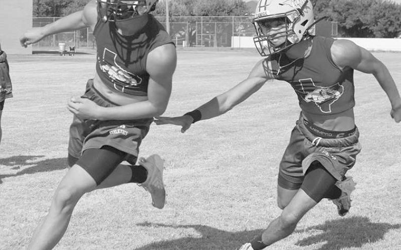 RUSHING MOVES - Anton athletes Autilano Castillo and Adrian Castillo were going against each other sharpening their skills. Pictured above are the two at Anton’s two-a-day practices in the early morning of the first day. (Staff photo by Aalijah Soliz)