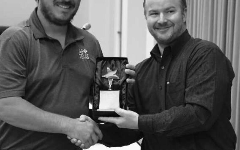 BUSINESS OF THE YEAR - During the Levelland Chamber of Commerce Volunteer Recognition Luncheon October 7, AgTexas Farm Credit Services was recognized as the Business of the Year. Pictured is Garth McDonald accepting the award on behalf of the business. (Staff Photo by Dominick Puente)