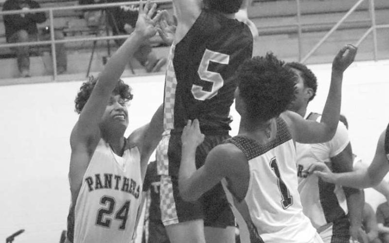 HIGH FLYING - Morton Indian Alex Lopez went over the Whitharral Panther defense to make the tough layup during the team’s district matchup last Tuesday. (Staff photo by Aalijah Soliz)
