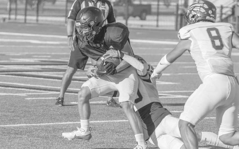 CAN’T BRING ME DOWN - Levelland Lobo Isaah Avendano caught the ball and broke the tackle this past Friday during the team’s first scrimmage of the year against Seminole. (Staff photo by Dom Puente)