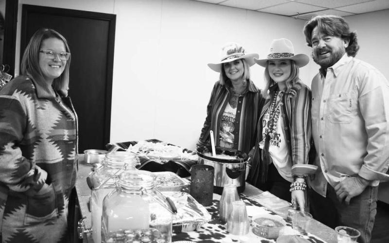 SILVERADO EXCITEMENT - Dana Bradley enjoyed her time with the Silverado staff as refreshments were being handed out by Carye Gruben, Kaelyn Blayne and Bruce Scott of Silverado during the Ladies Out Night even held by the City of Levelland Main Street program. (Photo courtesy of Delany Jackson)