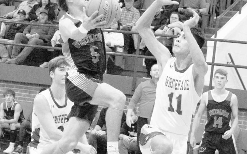 BLOCK ATTEMPT- The Whiteface Antelopes knocked off the Whitharral Panthers at home 53-50. Antelope Jeremias Chavez attempted to block Jack Griffin’s lay-up attempt. (Photo Courtesy of Janie Fryar)