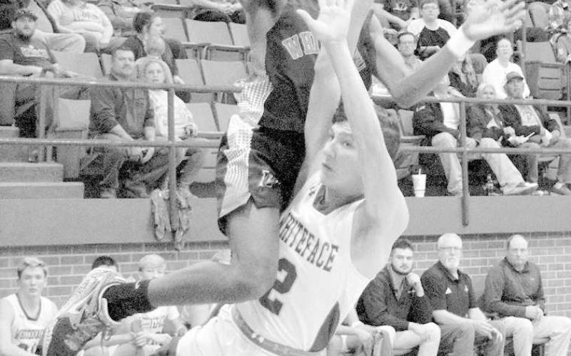ATHLETICISM- The Whiteface Antelopes knocked off the Whitharral Panthers at home 53-50. Whitharral Panther Shamadrick Weaver leaped over Antelope defender Noah Rector. (Photo Courtesy of Janie Fryar)