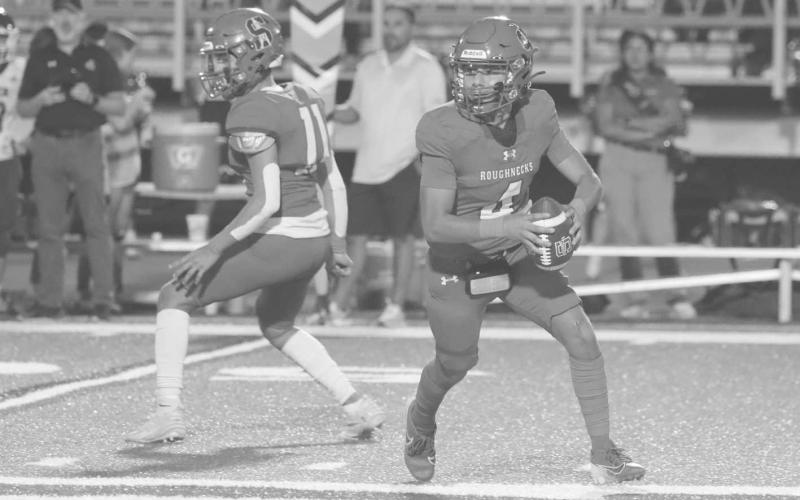 ON THE MOVE - Sundown Roughneck Adan Escamilla scrambled out of the pocket against the Smyer Bobcats last Friday in the team’s win. (Photo courtesy of Sundown ISD)