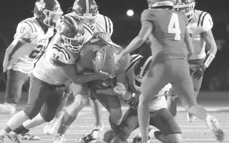 NO YARDS - Smyer Bobcat Richard Leary took down Sundown Roughneck Marcus Solis for a no-yard gain last Friday in the team’s district game. (Photo courtesy of Sundown ISD)