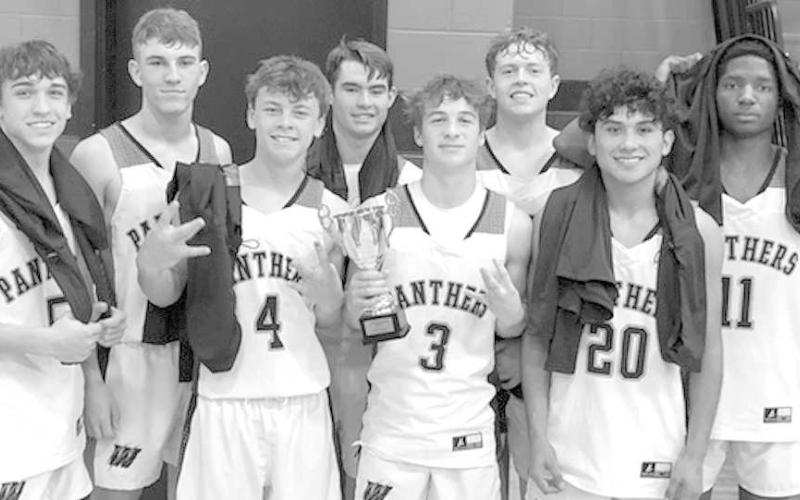 CONSOLATION- The Whitharral Panthers high school boys’ basketball team went 3-1 against tough competition in the Double T Smiles Bracket of the Caprock Invitational Basketball Tournament in Lubbock over the New Years’ weekend. downed the Quanah Indians 49-46 in the consolation round. The Panthers are at home against Anton on Friday at 8 p.m. (Photo Courtesy of Janie Fryar)