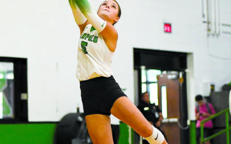 KEEP IT ALIVE – Braedyn Reyna twists and jumps to keep the volleyball in play during a game against Wellman Union this past Tuesday at the Ropes School. (Staff photo by Jentezen Smith)