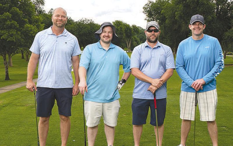 FLIGHT TWO CHAMPIONS- The United Supermarkets team claimed first place in Flight Two of the 2023 South Plains College Scholarship Scramble held Monday, June 5 at the Lubbock Country Club. Shown from left to right are: Kris Phillips, SPC Regent Ty Gregory, Terry Bryant and Lance Edwards. (Photo by R&amp;amp;P Photographers)