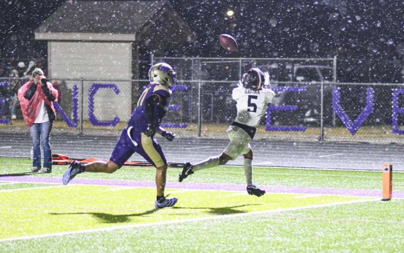 IT’S RAINING TD’S – Junior wide receiver Tobias Gavina catches a touchdown pass in the rain from Bryson Golighty during a football game against Dalhart this past Friday night at Memorial Stadium. (Staff photo by Jentezen Smith)