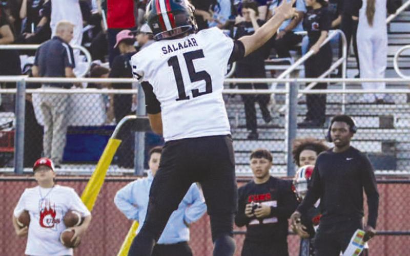 OFF-BALANCE - Levelland Lobo Ethan Salazar made the jumping throw to his receiver this past Friday against the Brownfield Cubs on the road. (Staff photo by Aalijah Soliz)