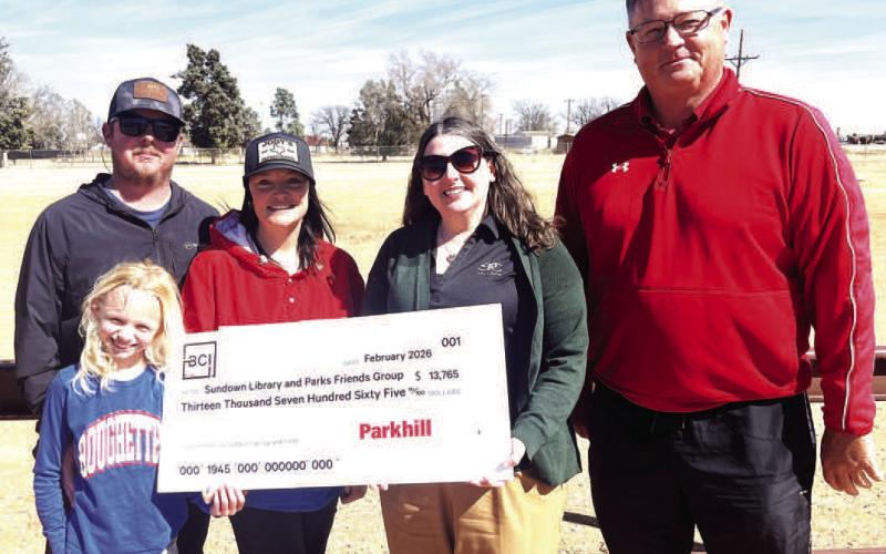 Sundown Rough Friends received a grant for improvements at the community softball field - (left to right) Chad, Amanda and Haidyn Harrall, Susan Dietz, treasurer of Roughneck Friends, and Ron Holson, Sundown councilman.