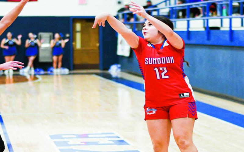IT’S RAINING THREES - Sundown Roughette Kathryn Flores shoots a three-pointer during their game against Smyer this past Friday night at Smyer High School. Flores would end with 14 points and three three-pointers made. (Staff photo by Jentezen Smith)