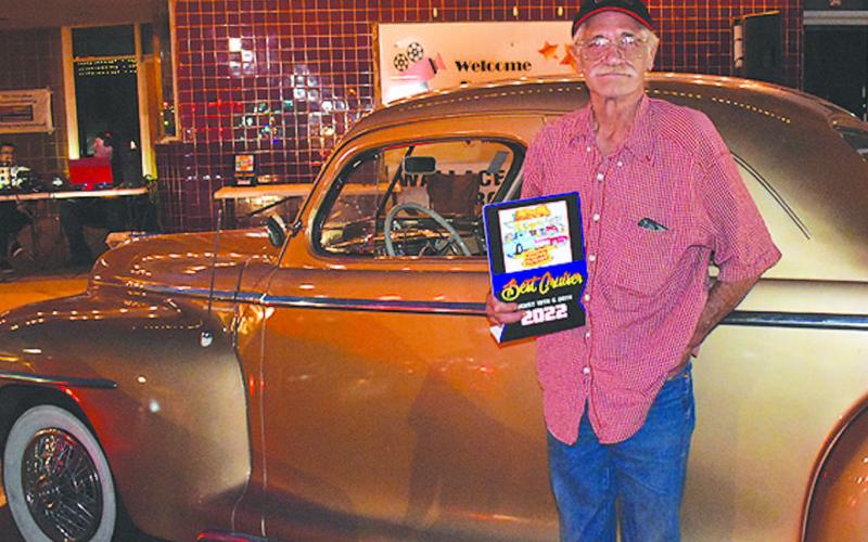 1947 PLYMOUTH– Mark Moyer of Levelland received a People’s Choice award for his golden beauty, a 1947 Plymouth, in the annual Thunder on the Plains Cruise Friday night. Moyer purchased the classic car a year and a half ago and has thoroughly enjoyed taking it to car shows. (Staff Photo)