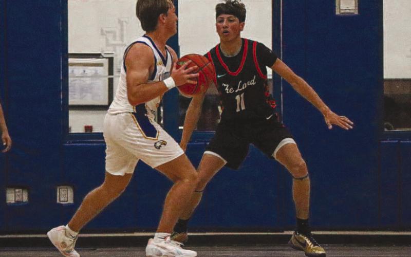 LOCKED DOWN - Levelland Lobo Jefferey Cisneros made the Eagle ball carrier pick up his dribble with his defense on the road. (Staff photo by Aalijah Soliz)