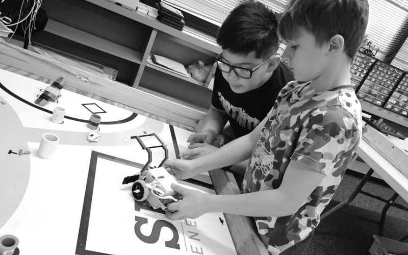 GEARING UP - Capitol students are preparing for their Robotics competition under the direction of Mrs. Clara Sanders. The Robotics students have been working and practicing with coding to control their robots. They get their new theme and maps on February 1, for this years competition. Pictured are Harrison Randol and Leonardo Ochoa Perez. (Photo courtesy of Cristal Isaacks)