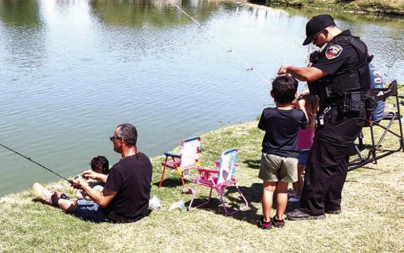 CASTING WITH COPS – Pictured are participants in Saturday’s Casting with Cops event at Lobo Lake. The second annual event featured fishing, lunch provided by the Lions Club and a chance to get to know local law enforcement. (Staff photo)