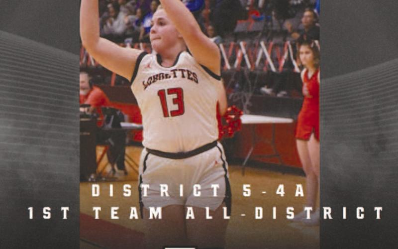 FIRST TEAM- Levelland basketball coaches Barnett, Nathan Riggan and Mark Elbert-Rios share the Levelland Loboette varsity basketball was well represented during district play this year and that they earned many all-district accolades. First Team All-District was senior forward Laci White. (Photo Courtesy of Cristal Isaacks)