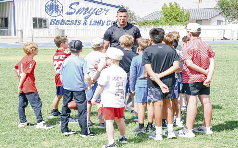 BUILDING FUTURE BOBCATS - Smyer Bobcats Athletic Director &amp;amp; Head Football Coach Scott Funke instructs the Bobcat campers this past Tuesday during their football session at Smyer High School. Campers ranged from first to sixth grade. (Staff photo by Jentezen Smith)