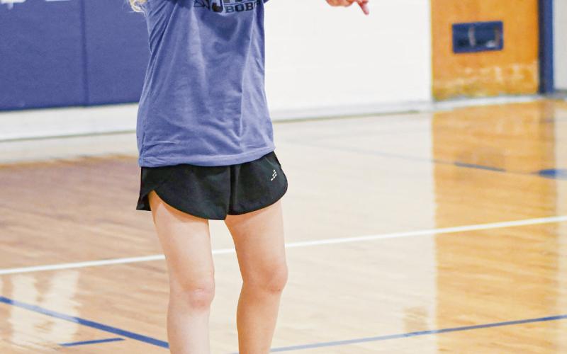 PRACTICING PASSES - Lady Cat camper Ella Copeland practices passing the volleyball this past Tuesday during their volleyball session at Smyer High School. (Staff photo by Jentezen Smith)