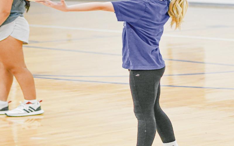 SERVING ROUTINE - Lady Cats camper Bristol Pittman performs her serving routine this past Tuesday during their volleyball session at Smyer High School. (Staff photo by Jentezen Smith)