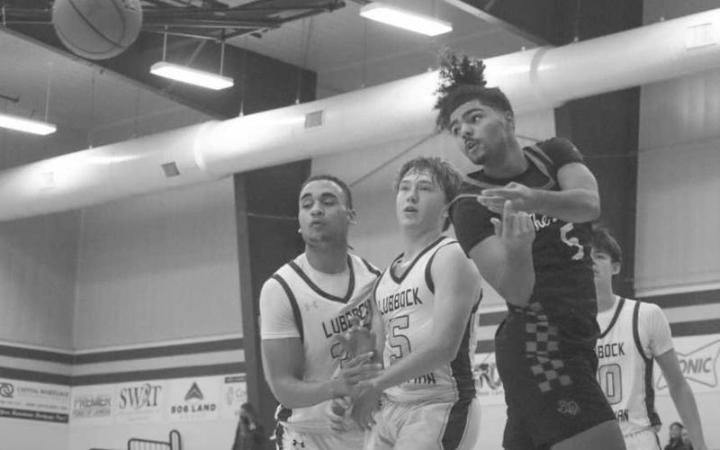 FLASHY PASS - Levelland Lobo Sean Landrum passed the ball behind his back to an open teammate during the team’s game this Thursday in Lubbock. (Staff photo by Aalijah Soliz)