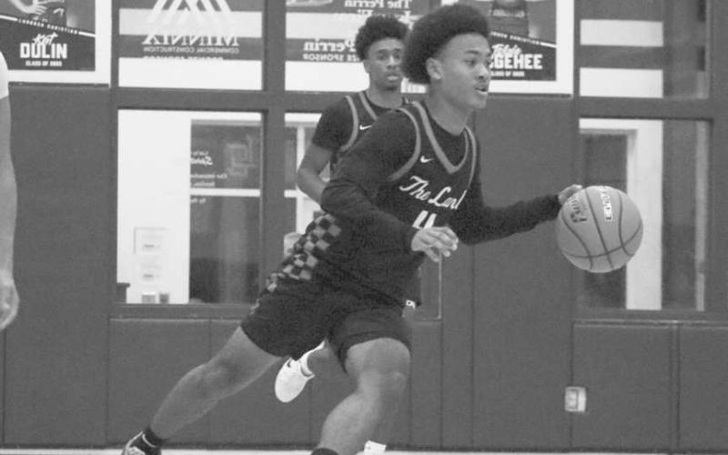 QUICK TRANSITION - Levelland Lobo Bryson Golightly brought the ball down the court after getting the outlet pass during the team’s win against the Eagles. (Staff photo by Aalijah Soliz)