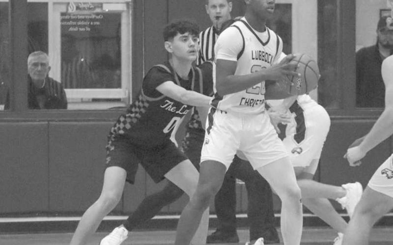 DEFENSE - Levelland Lobo Anthony Gonzales kept the Lubbock Christian Eagle in front of him not letting him get into the paint during the team’s game this Thursday. (Staff photo by Aalijah Soliz)