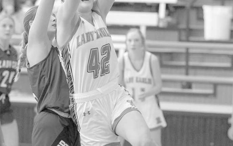 TOUGH LAY UP- The Ropes Lady Eagles downed the visiting Smyer Lady Cats 65-36 last week in UIL high school girls’ basketball action. Lady Eagle Ava Grace Falls laid the ball in the paint with a defender on her back. (Photo Courtesy of Donovan Martin)