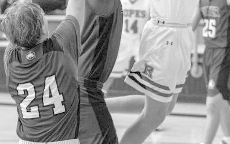 OVER TWO DEFENDERS- The Ropes Eagles downed the visiting Smyer Bobcats 55-31 in UIL high school boys’ basketball action last week. Kade Franklin ignored contact and put up a shot over two defenders. (Photo Courtesy of Donovan Martin)