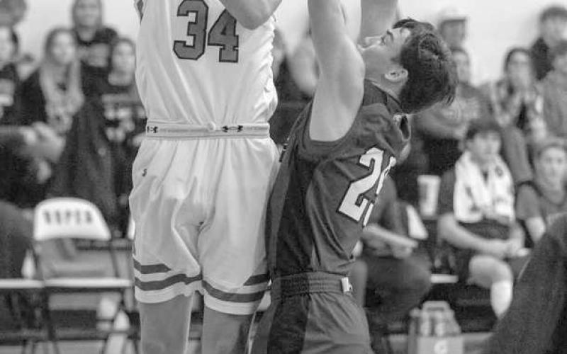 HOOK SHOT- The Ropes Eagles downed the visiting Smyer Bobcats 55-31 in UIL high school boys’ basketball action last week. Landon Sale got two of his team high 12 points in the paint. (Photo Courtesy of Donovan Martin)