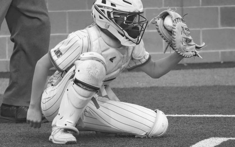 STRIKE - Sundown Roughette Brynly Gregory caught the ball after her pitcher Breigh Gregory struck out the batter during the team’s game against the Lady Lions March 29. (Staff photo by Aalijah Soliz)