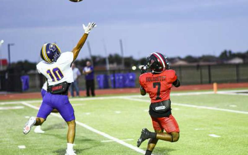GOLIGHTY FOR 6 – Sophomore wide receiver Bryson Golightly catches a deep ball and takes it for a touchdown during a game against Pecos at Lobo Stadium this past Friday night. Golightly would have three receptions for 95 yards and a touchdown in the Lobos win. (Staff Photo by Jentezen Smith)