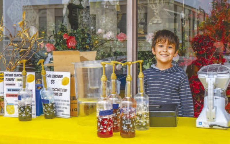 - Liam Gonzales volunteered his time making snow cones on Saturday for Levelland’s Lemonade Day. (Staff photo by Hannah Woodrum)