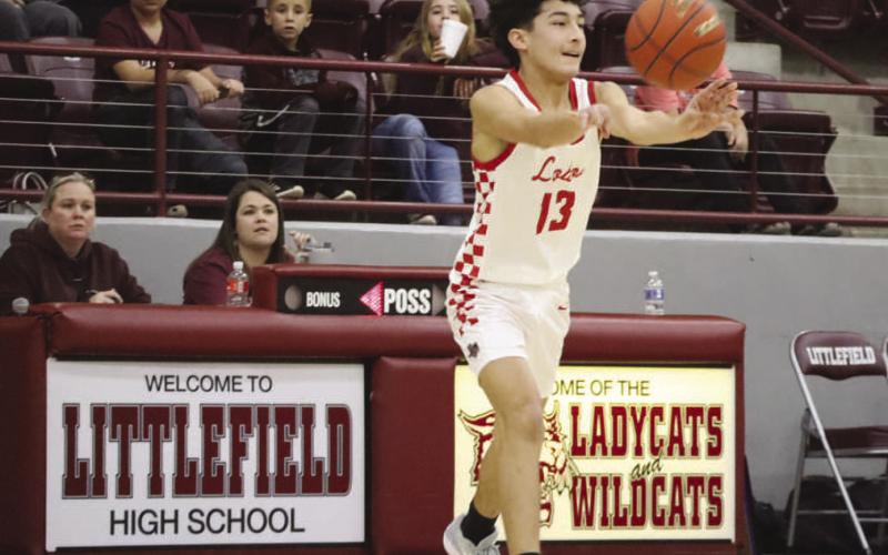 PASS - Levelland Lobo Ethan Salazar passed the ball to his teammates in transition to help the offense pick apart the defense last week in the Littlefield Tournament. (Staff photo by Aalijah Soliz)