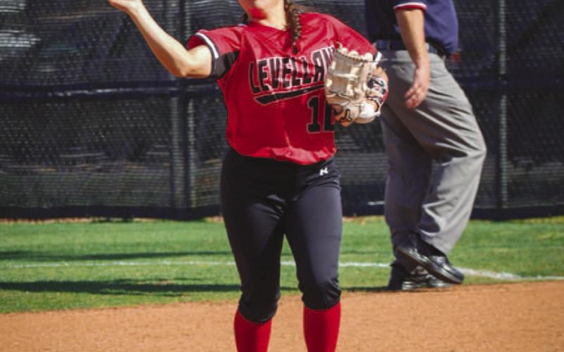 PLAYMAKER - Levelland Loboette Delaney Delgado threw the ball back in play after catching a pop fly during the team’s game against the Estacado Lady Mats last Friday. (Staff photo by Aalijah Soliz)