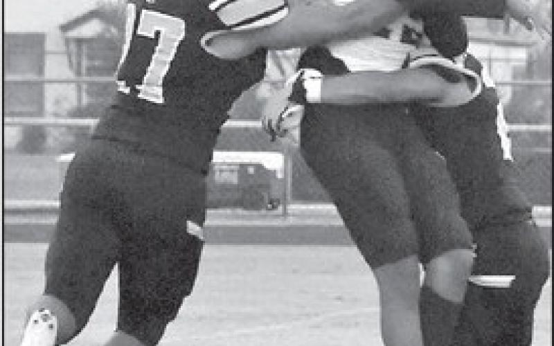 BACKFIELDPRESSURE- Morton’s Andreas Bejarano and Christian Enriquez kept pressure on Plains’ backfield in a 22-2 home loss to the Cowboys last Friday to open UIL Class 2A-2 Region 1, District 4 high school football action. The Indians will be in Ropes on Friday night to face the Eagles at 7 p.m. (Photo Courtesy of Jay Kelley)
