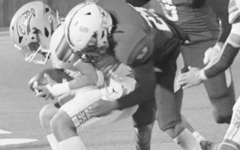 AGGRESSIVE - The aggressiveness of the Whiteface kick-off team helped the Antelopes to an 82-36 win over the Borden County Coyotes last Saturday in the UIL Class 1A-1 six-man high school football playoffs in Lockney. Victor Borunda is shown stopping a Borden County runner in his tracks with Axel Rivera and Cash Crutcher on the way to back him up. The Antelopes will play Water Valley in the state semi-finals on Saturday in Lamesa at 2 p.m. (Picture by Holly Crutcher)