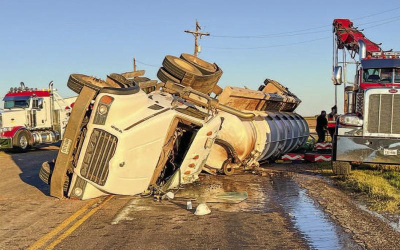 COUNTY ROLLOVER - According to Levelland-Hockley County Emergency Management, a semi traveling near the intersection of FM 1294 and FM 2130 was involved in a single-vehicle wreck. The roadway was blocked by public safety personnel from 5:30 p.m. and re-opened at 8 p.m. (Staff photo by Dom Puente)