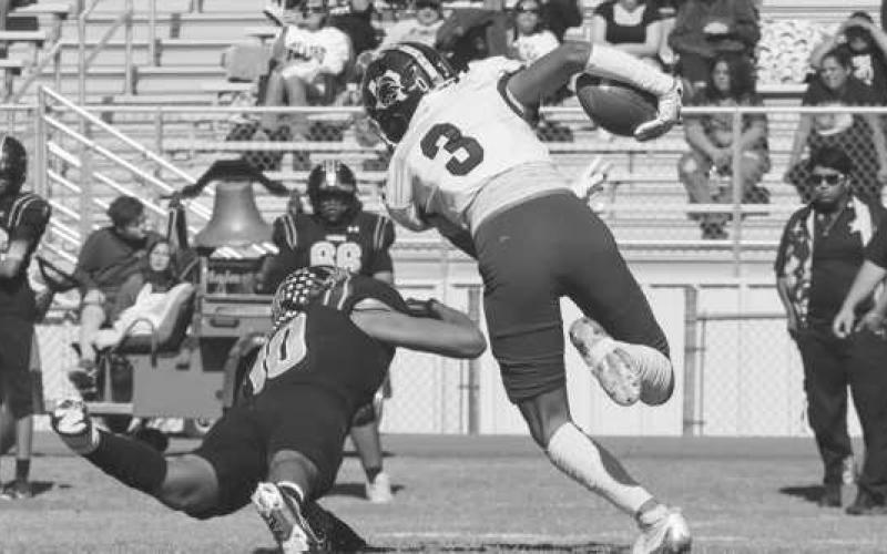 GREAT BALANCE - Smyer Bobcat Ryan Gutierrez kept his balance while almost being brough down last Friday afternoon against Plains. (Staff photo by Aalijah Soliz)