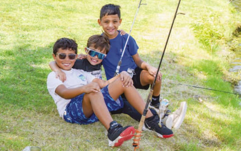 CATCHING FISH- Lobo Lake has reached a healthy level due to the recent rain fall over the past few weeks. Pictured is Zade Ruiz, Jett Gonzales and Victor Miranda enjoying their time togeather fishing along the lake. (Photo courtesy of Emily Campos)