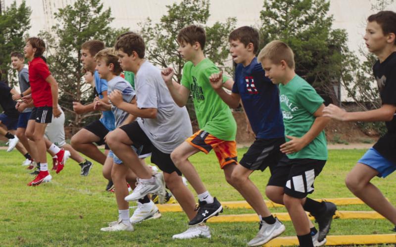 HIGH KNEES - The coaching staff for the Ropes Eagle Football Camp had the campers warming up for the day this past Monday at the Ropes Football Field. (Staff photo by Aalijah Soliz)