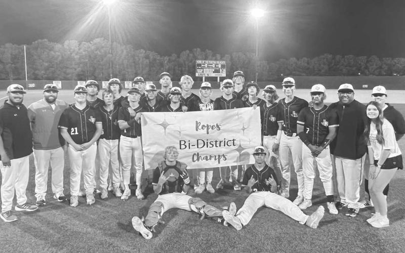 BI-DISTRICT CHAMPS - The Ropes Eagles took on the Olton Mustangs this past Thursday in Littlefield where the Eagles won 9-0 to take the Bi-District Championship. Pictured above is the team and the coaches celebrating their win. (Photo courtesy of Ropes ISD)