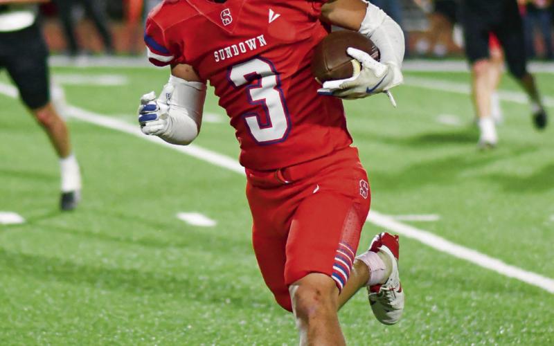 GADGET THREAT - Senior Coen Nevarez goes for extra yardage after a catch during Sundown’s football game against Plains this past Friday night at Slaughter Field. He would end up with 47 receiving yards and a rushing touchdown. (Staff photo by Jentezen Smith)