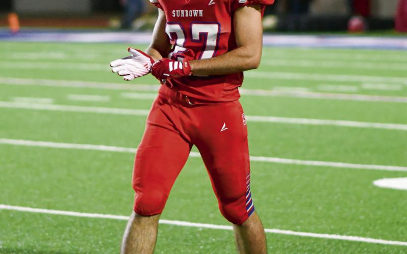 GETTIN’ SET - Senior wide receiver Nathan McAdams gets set for the snap during Sundown’s football game against Plains this past Friday night at Slaughter Field. McAdams would have two catches for 36 yards. (Staff photo by Jentezen Smith)