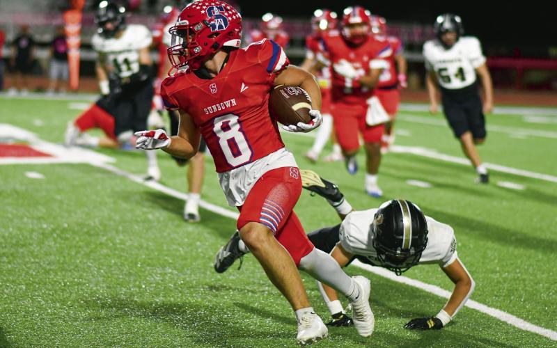 LARA ON THE RUSH - Senior running back Braiden Lara rushes the football for Sundown during their matchup against Plains the past Friday night at Slaughter Field. Lara would end up with three carries for 21 yards in Sundown’s 35-7 win. (Staff photo by Jentezen Smith)