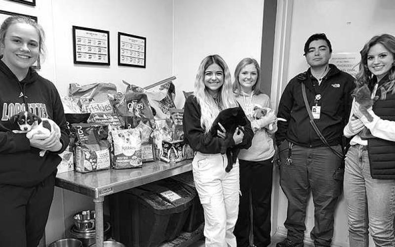 GIVING TUESDAY– The Levelland High School National Honor Society community service project was the Levelland Animal Shelter Adopt-A-Pet program. NHS members donated approximately 1,000 pounds of dog and cat food for the animals at the shelter for Giving Tuesday. Pictured from the left are LHS NHS Officers: Laci White, president; Heidi Marquez, vie-president; Brittan Dobson, historian; Taylor Perez, shelter employee; and Alanna Worley, secretary and treasurer. (Submitted Photo)