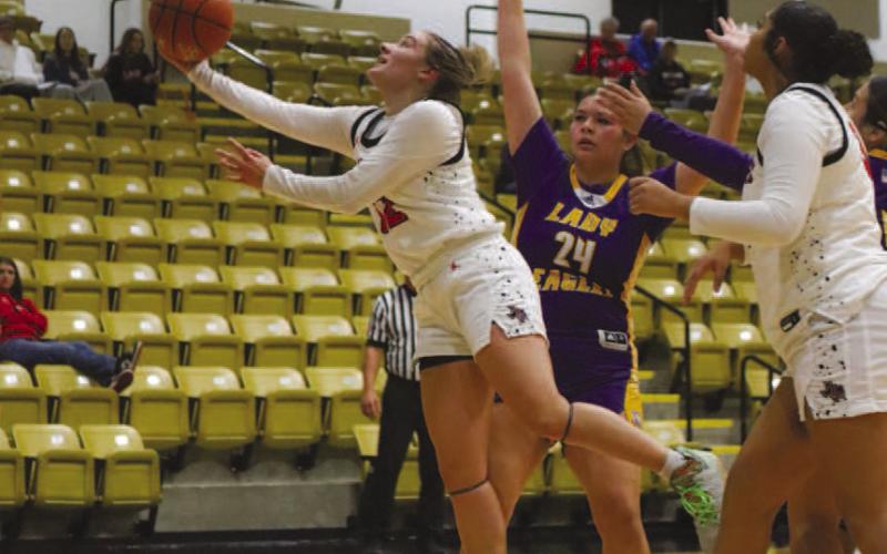 UPAND UNDER - Levelland Loboette Emery Smith made the tough layup during the team’s game against the Pecos Eagles this past Thursday in Andrews. (Staff photo by Aalijah Soliz)